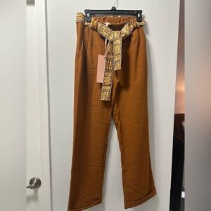Scandalitaly pants with belt. Size medium. New with tags.